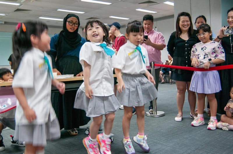 Children and families sharing an excited moment at the event